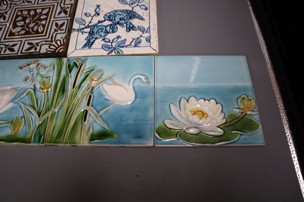 A set of four Victorian coloured tiles, 15cm and two other tiles